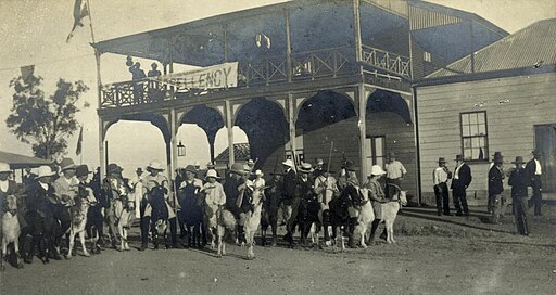 512px-StateLibQld_1_235927_Children_form_a_goat_escort_for_the_Governor,_Georgetown,_June_1908